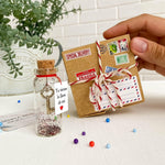 Load image into Gallery viewer, Mensaje romántico en una botella para regalar a tu novio o novia Tarro de los deseos con una tarjeta para tu esposo o esposa (bottle in cute craft paper box Tu tienes la llave de mi corazón)